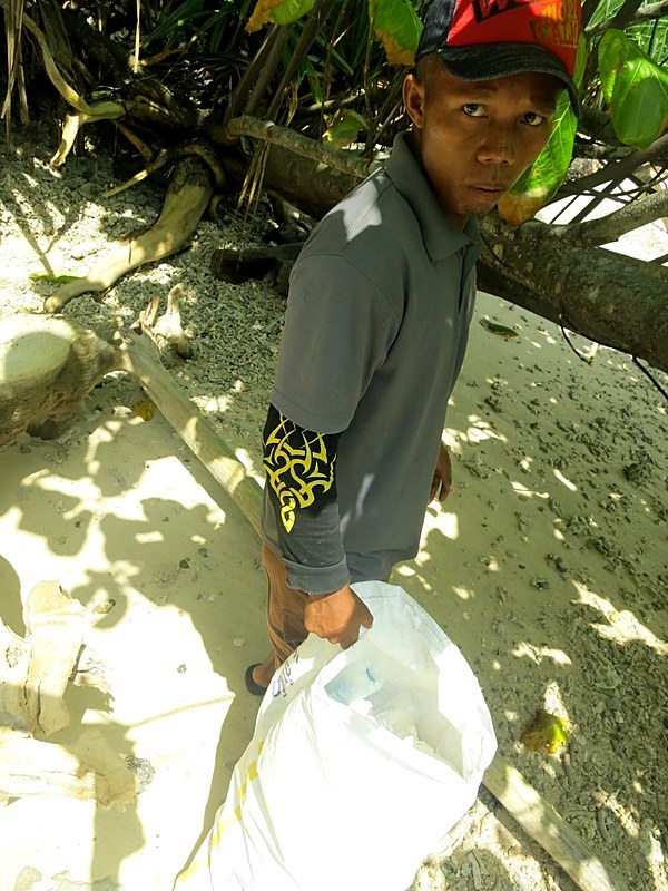 Surveying the shoreline for oil residue, January 2014