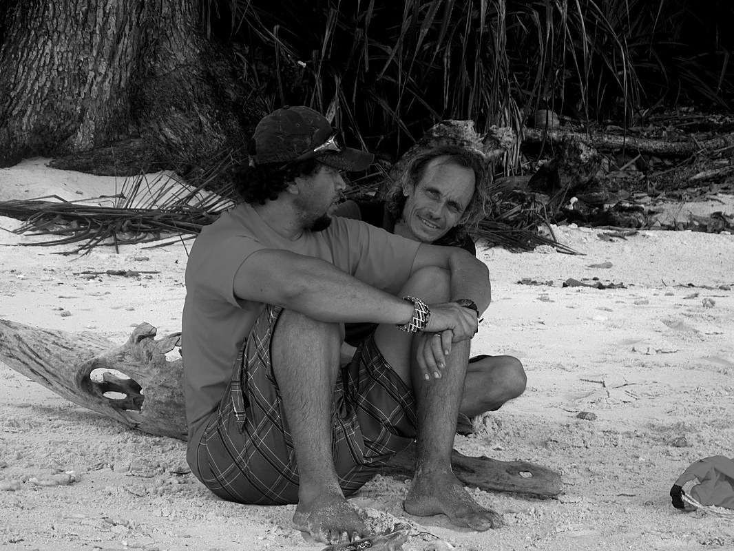 Two old friends sitting on the beach, Merapas